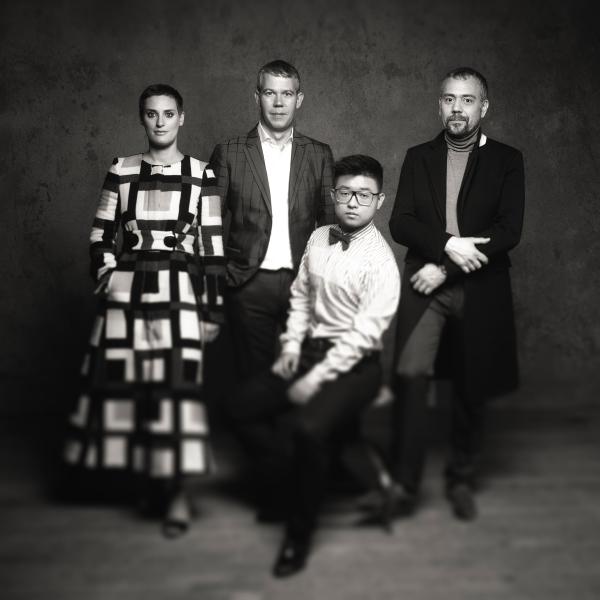 Members of string quartet Quatuor Diotima posing in black and white