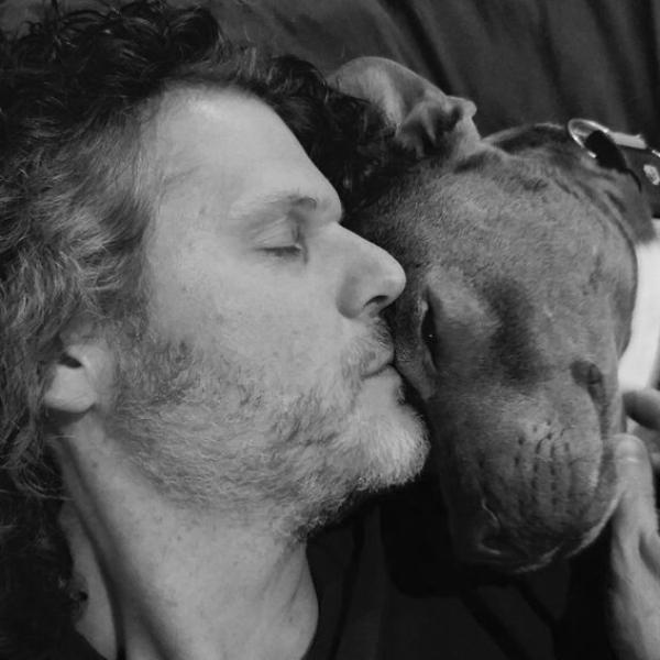 Photo of Jason Eckardt with a dog